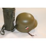 A COPY 1935 PATTERN GERMAN HELMET etc A copy or replica 35 pattern German helmet with army decals.