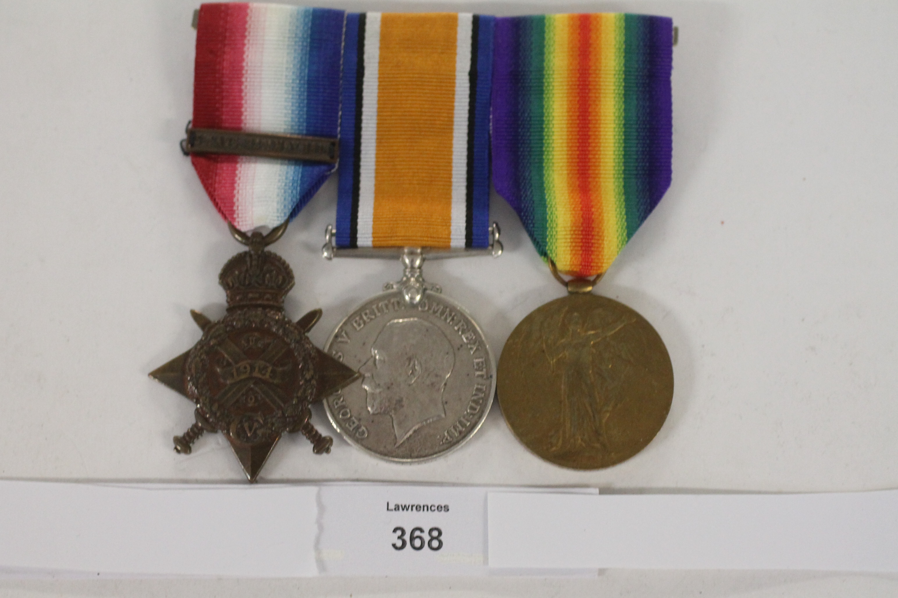 A SCOTS GUARDS 1914 STAR/BAR TRIO. A 1914 Star with bar also British War & Victory Medals named to