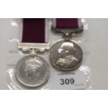 TWO LONG SERVICE GOOD CONDUCT MEDALS. An Edward V11 issue Long Service Good Conduct Medal, awarded