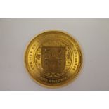 A GOLD COLLEGE MEDALLION. A 31 grams 18ct or higher medallion awarded by Trinity College Dublin in