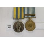 A ROYAL ARMOURED CORPS KOREA PAIR. A Korea Medal named to 22306500 Tpr J R Eunson R.A.C. A United