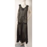 A 1930'S BLACK SILK & DIAMANTE EVENING DRESS Sheer black silk falling to a drop waist with lines