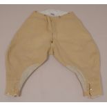 A PAIR 1950'S RIDING JODHPURS These heavy cream cord jodhpurs have come from a Wiltshire racing