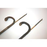 TWO BAMBOO HORSE MEASURING STICKS two similar bamboo walking sticks with silver mounts, the cavities