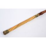 IVORY HANDLED DRIVING WHIP a driving whip with a decorative ivory handle and gilt metal mounts,