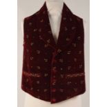 A C19TH VELVET EMBROIDERED WAISTCOAT. Deep wine red velvet with metal embroidered flowers and