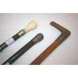 WALKING STICKS including a horn handled walking stick with a malacca shaft and silver or silver