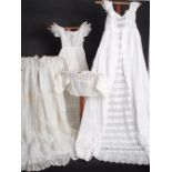 A BOX OF EXQUISITE CHRISTENING ROBES A box with an aristocratic provenance. Beautiful christening