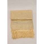 A GOLD SILK SHAWL In beautiful condition sheer silk in gold and silver, with a gold fringe. shawl