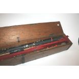 ANTIQUE FISHING ROD CASE a wooden case containing 6 various rods, including Dam & Abu. (7)