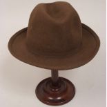 A BROWN TRILBY HAT 20cms x 17cms Labelled 'Locke & Co St James Street London' . (Small mark on