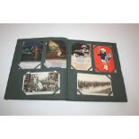 POSTCARD ALBUM - MILITARY an album of WW1 period postcards including, Happy Tommies wearing Hun