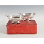 A pair of Edwardian silver oval-shaped twin handled baskets, Glasgow, 1914, makers mark of R&W