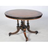 A Victorian amboyna, ebonised and marquetry centre table, the oval shaped top with broad inlaid