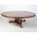An exceptionally large Scottish William IV oak and ebony inlaid circular dining table, the hinged