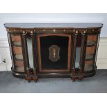 A Victorian ebonised burr walnut and gilt metal mounted credenza, the shaped top above a panelled