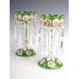 A pair of late 19th century Bohemian green and opaque white glass lustres, suspending clear glass