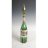 A late 19th century Bohemian green and opaque white glass overlaid decanter and stopper, decorated