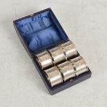 A set of six Victorian silver napkin rings, Birmingham, 1864, makers mark of AT, numbered 1 to 6