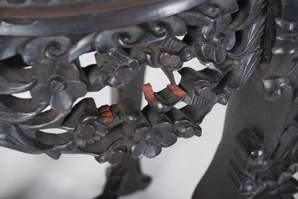 A Chinese dark wood jardiniere stand, Qing Dynasty, the circular panelled top above a pierced and - Image 5 of 5