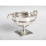 A George V silver twin handled cup, Birmingham, 1927, makers mark slightly rubbed probably that of