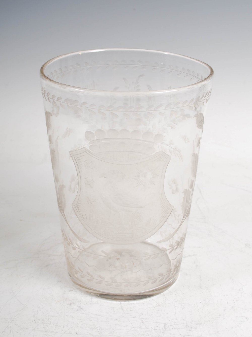 A 19th century Continental glass vase, of tapered cylindrical form with wheel cut decoration of a