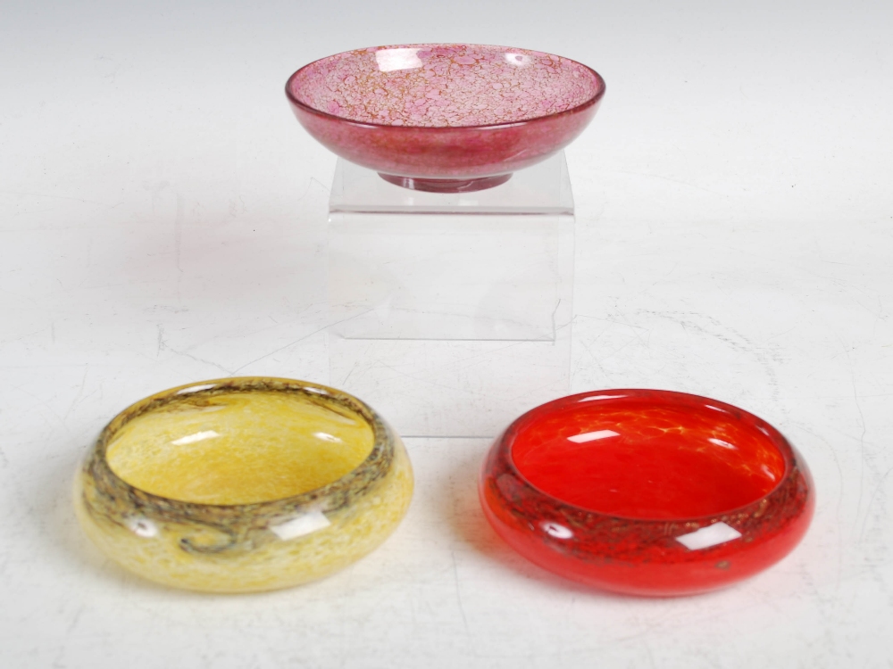 Three Monart bowls, two shape Y and one shape O, comprising; a mottled red shape Y, 12.5cm diameter,