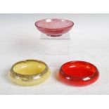 Three Monart bowls, two shape Y and one shape O, comprising; a mottled red shape Y, 12.5cm diameter,