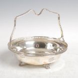 A George VI silver basket, Sheffield, 1937, makers mark of GH, with shaped handle and pierced rim,