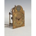 An 18th century lantern clock with dial inscribed 'Jonathan Lowndes in ye Pall Mall', bearing