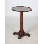 A 19th century mahogany occasional table, the circular top with a moulded edge raised on a tapered