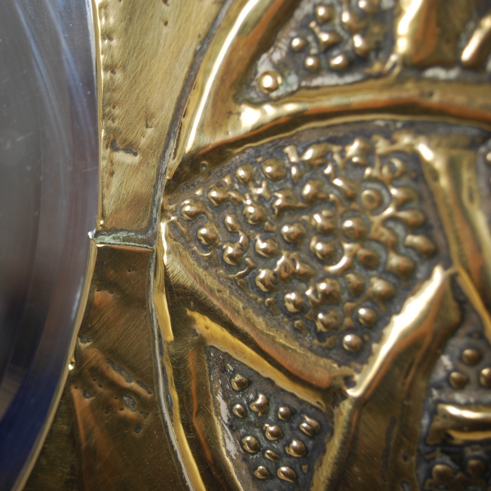 A Scottish Arts & Crafts brass wall mirror, the oval bevelled mirror plate within an embossed Celtic - Image 8 of 10