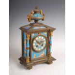 A late 19th century French ormolu and porcelain mounted mantle clock, the circular dial with Roman