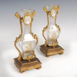 A pair of late 19th century French gilt metal mounted glass bud vases, of square baluster form