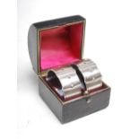 A pair of Victorian silver novelty napkin rings formed as buckled belts, Sheffield, 1894, makers