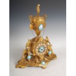 A late 19th century French ormolu and opaline glass mounted mantle clock, the circular dial with