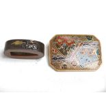 A Japanese bronze Fuchi and a Cloisonne brooch, Meiji Period, the Fuchi decorated with a stag, 3.7cm