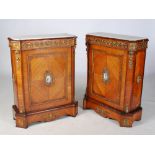 A pair of Victorian kingwood and ormolu mounted marble topped pier cabinets, the white and grey