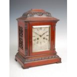 A late 19th century mahogany bracket clock, the silvered dial with Roman numerals and engraved