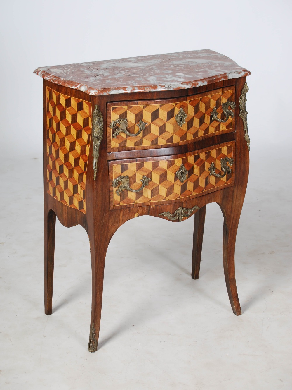 A late 19th century French kingwood, parquetry and gilt metal mounted commode, the red and white