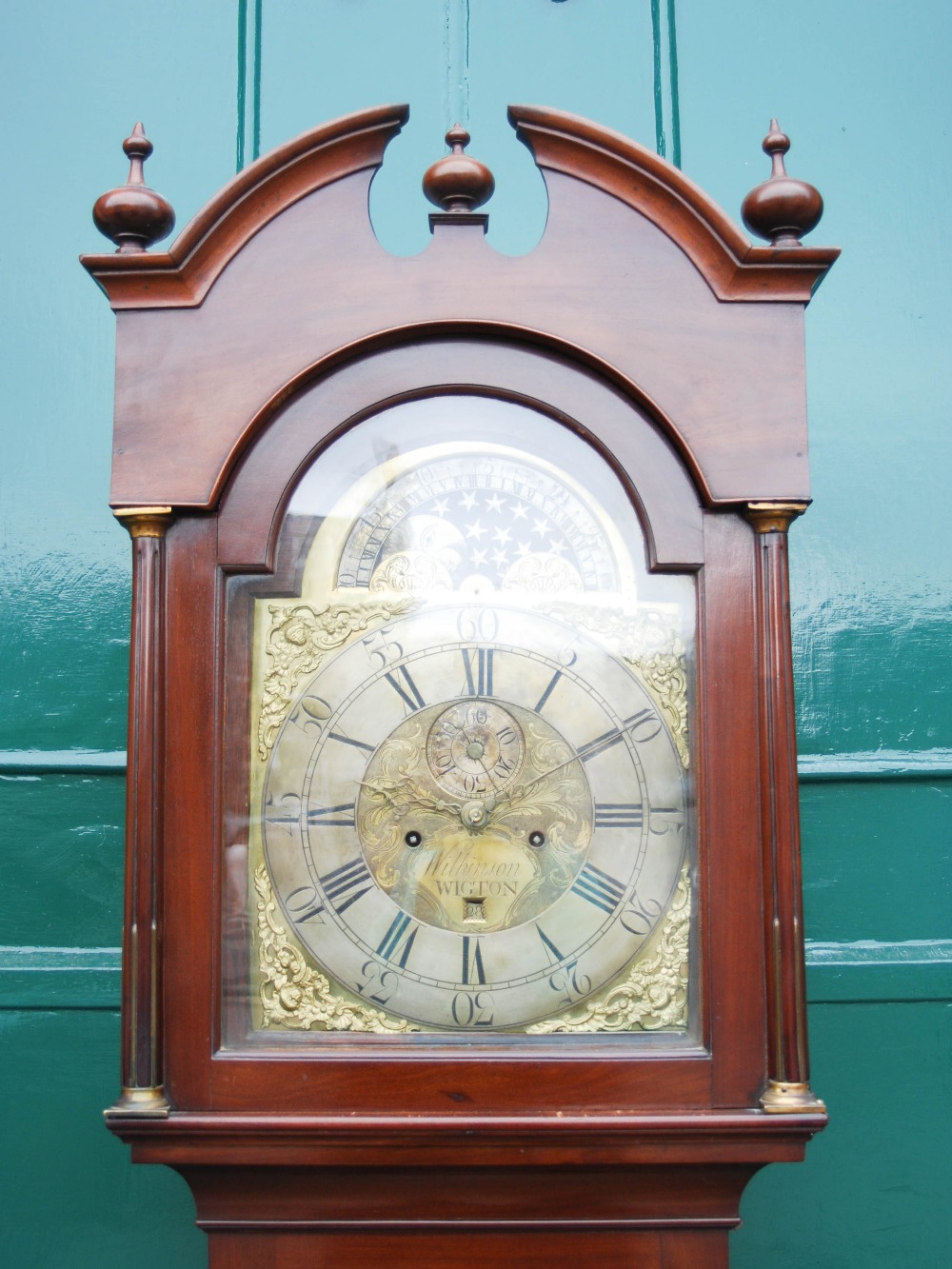 A George III mahogany longcase clock, Wilkinson, WIGTON, the brass dial with silvered chapter ring