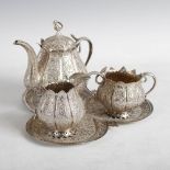 A late 19th century Indian silver four piece tea set, comprising a pear-shaped teapot and cover,