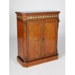 A Victorian amboyna, gilt metal and porcelain mounted side cabinet, the rectangular top above a
