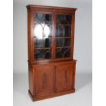 An Edwardian mahogany and satinwood banded bookcase, the moulded cornice with Greek key detail,