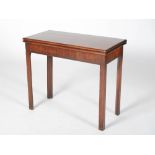 A George III mahogany tea table, the hinged rectangular top with a moulded edge above a plain