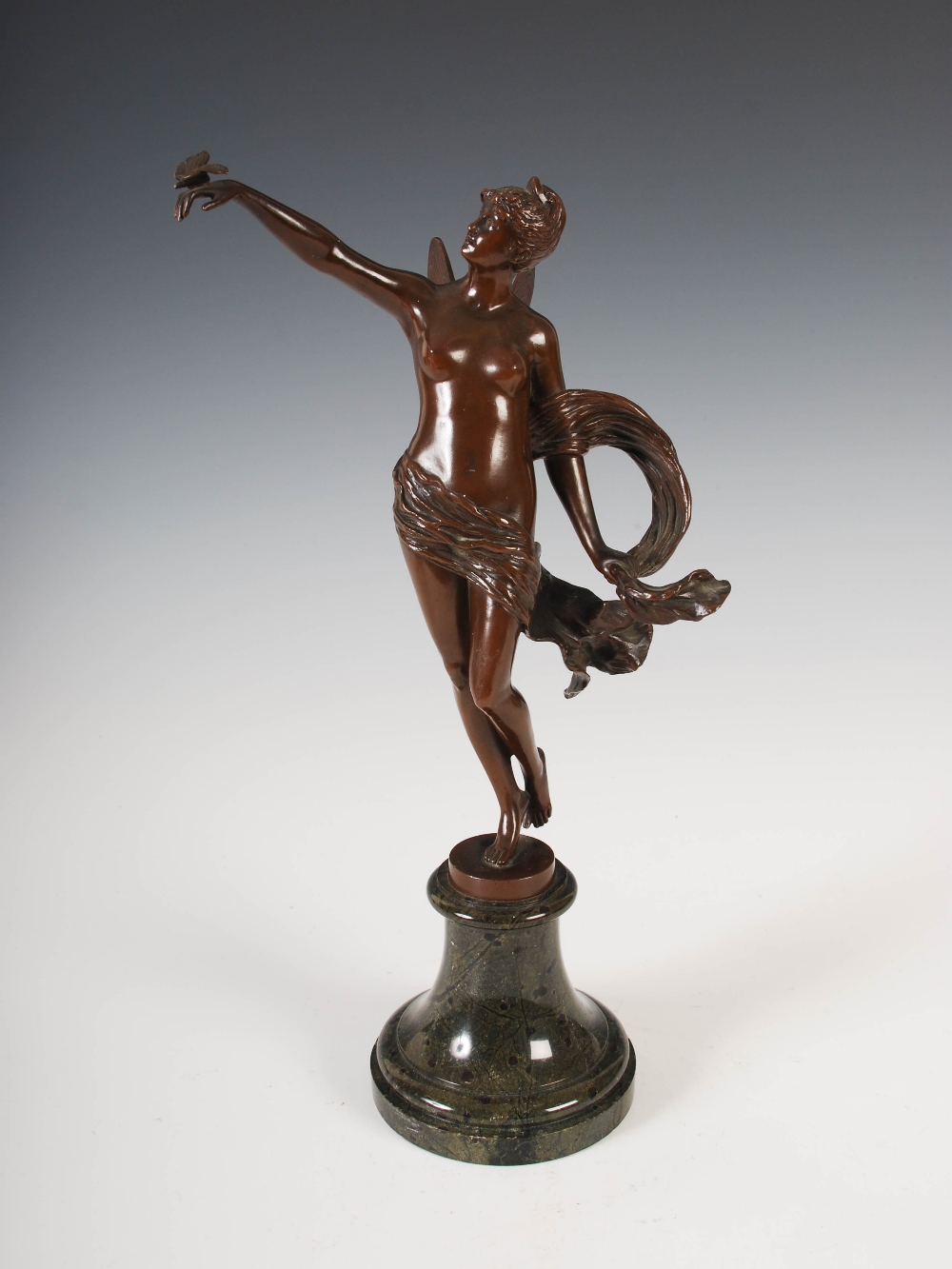 Franz Rosse, a bronze figure of a fairy, modelled standing with her right arm raised supporting a