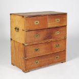 A late 19th century teak and brass bound two part military chest, the upper part with two small