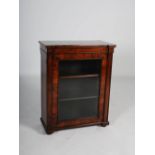 A 19th century rosewood bookcase, the rectangular top above a glazed cupboard door opening to a