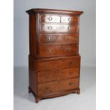 A 19th century mahogany chest on chest, the moulded cornice and dentil frieze above two short and