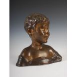 An early 20th century bronze bust of a young boy, 30cm high x 28.5cm wide.